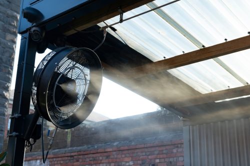 Water mister fan blows cool water into the air