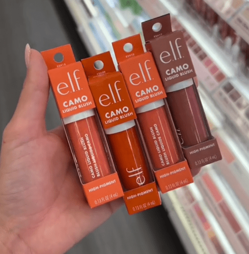 Shopper holding up e.l.f. blushes at Target