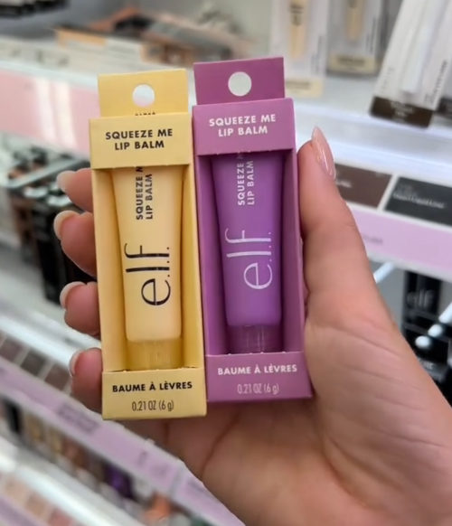 Shopper holding up e.l.f. lip balms at Target