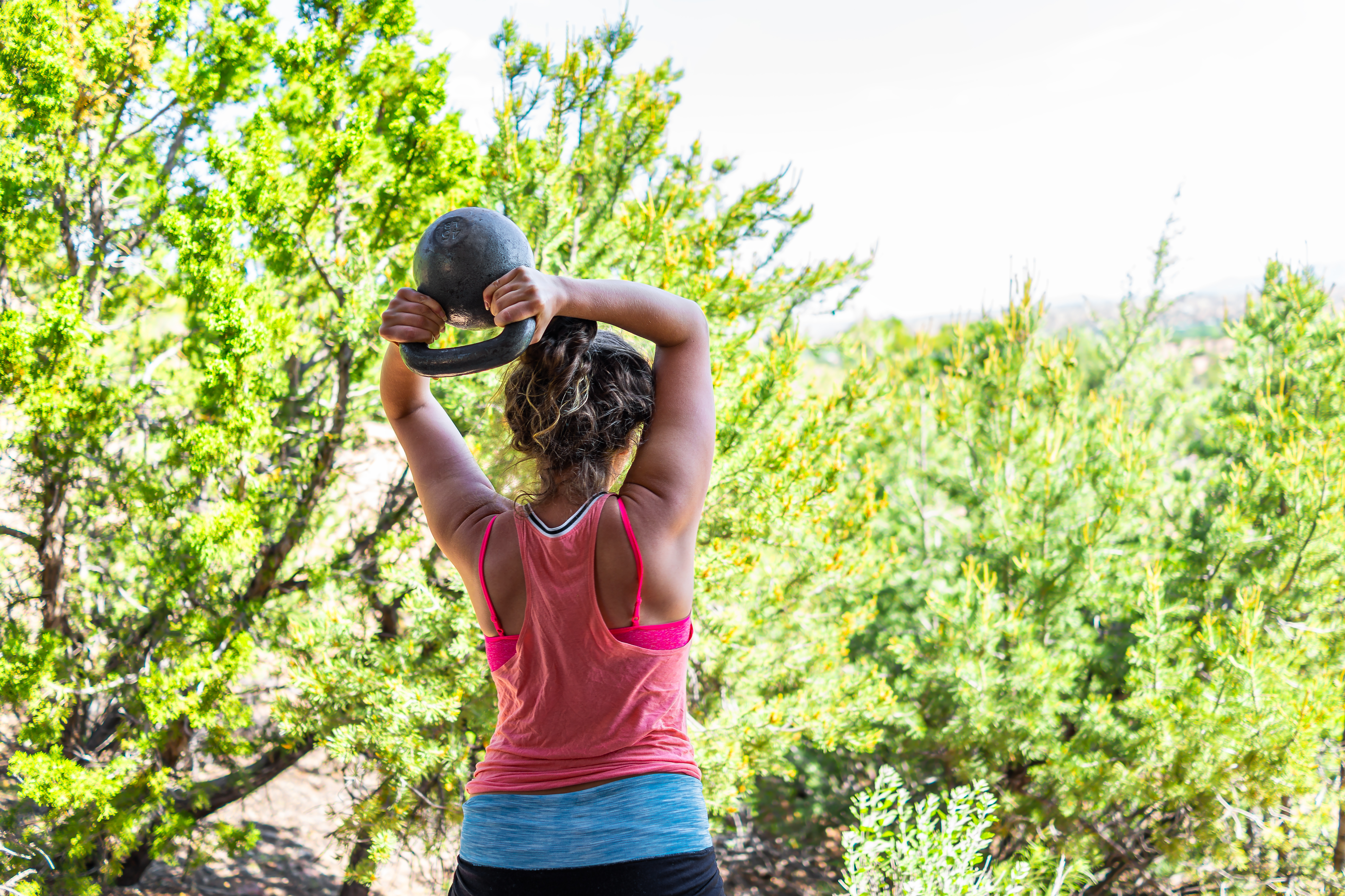 Woman doing kettlebell halo