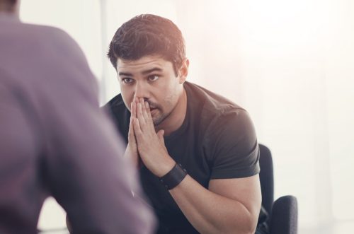 man getting bad news at work