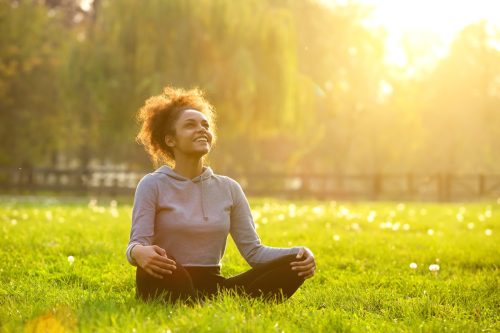 woman doing yoga affirmations