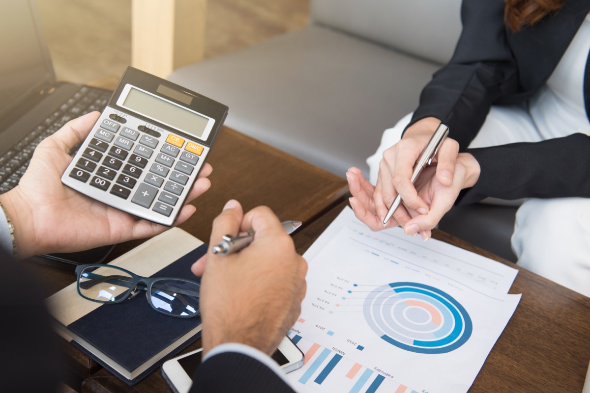 A close up of a person meeting with a Financial Advisor