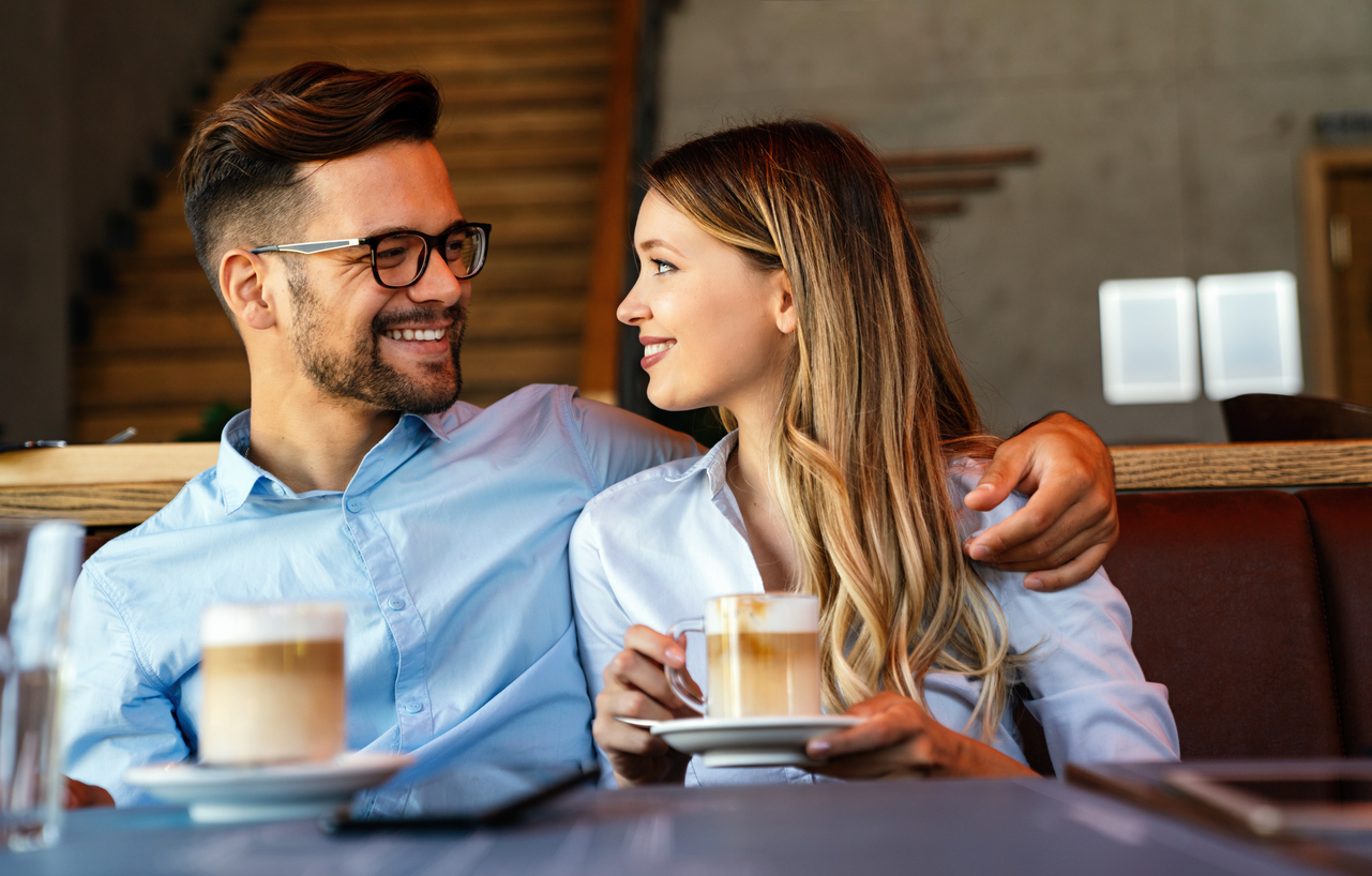 young couple on a date having coffee