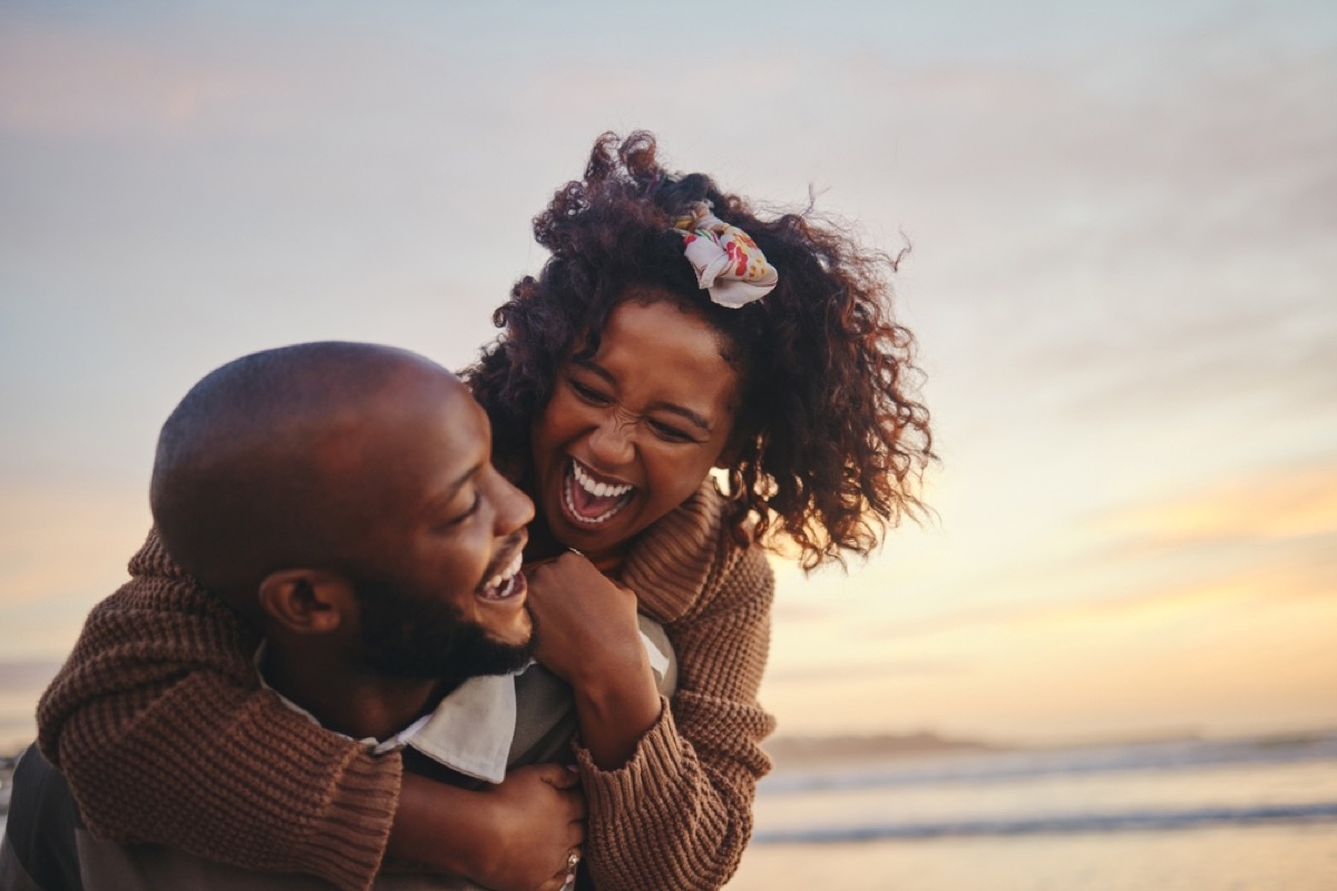 couple laughing on the beach