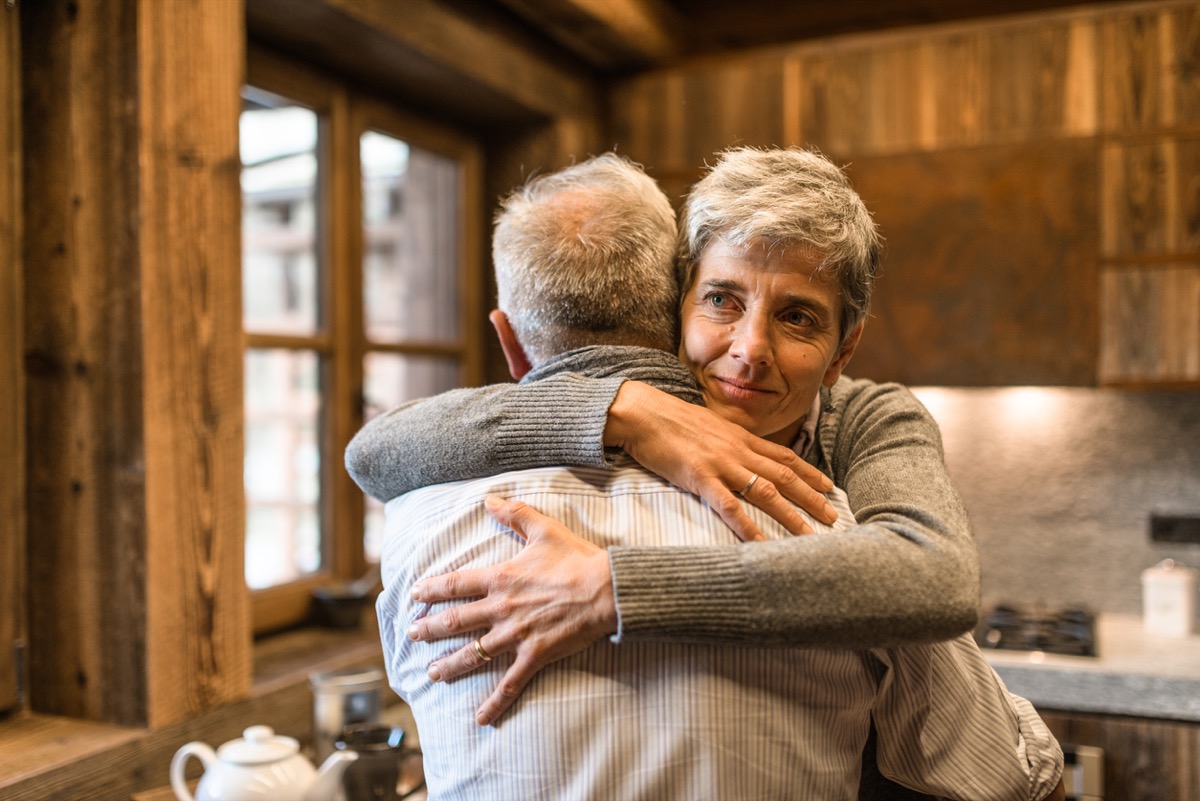 senior couple embracing at home