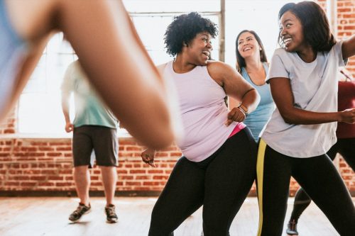 women having fun in dance fitness class