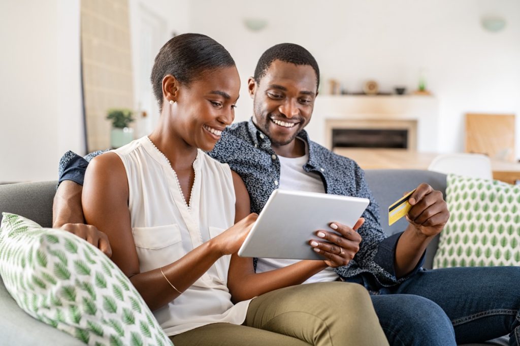 Man and woman looking at a tablet