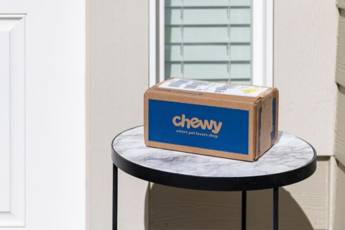 A delivered package from Chewy Pharmacy, the company that specializes in pet food, prescriptions and supplies, outside the door of a home.