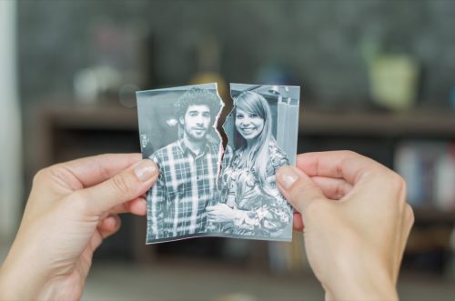 ripped photo of a couple who has recently broken up