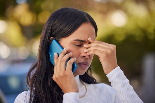 stressed out woman on the phone