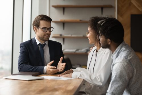 Financial advisor talking to young couple