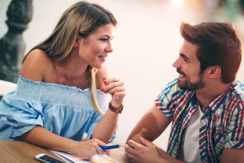 man and woman flirting on a first date