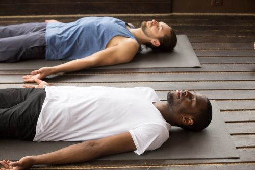 men in savasana