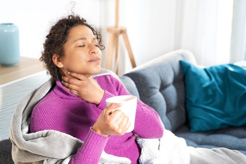 woman with sore throat