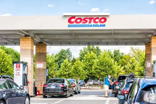 Cars waiting at a Costco gas station on a sunny day