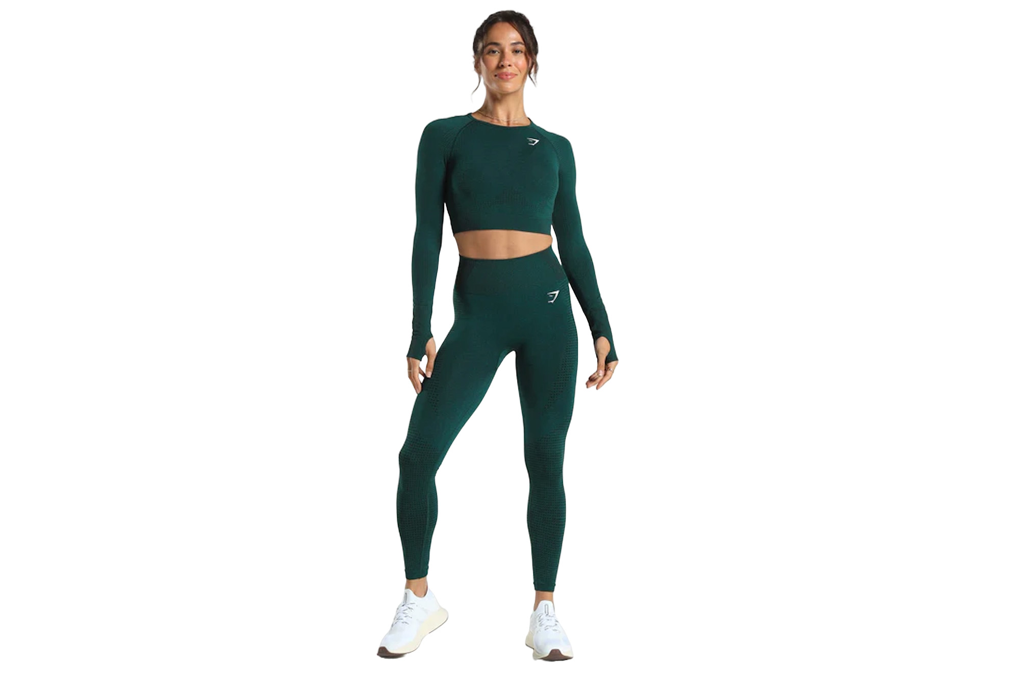 Một người mẫu mặc quần legging màu xanh lá cây